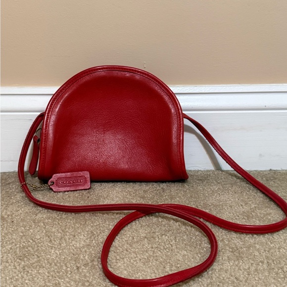 Coach Handbags - vintage Coach Kimball half-moon crossbody bag made from red leather.